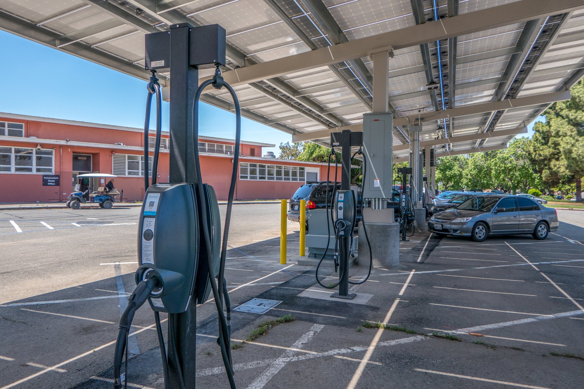EV charging stations installed under a solar canopy to support fleet, employee, and visitor charging.