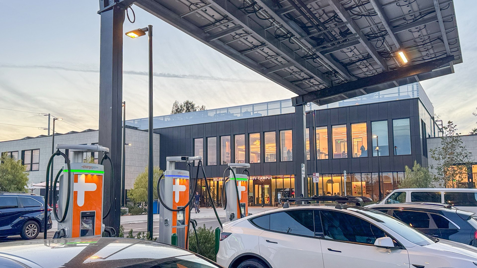 EV charging stations installed under a solar canopy providing convenient charging access for electric vehicle drivers.