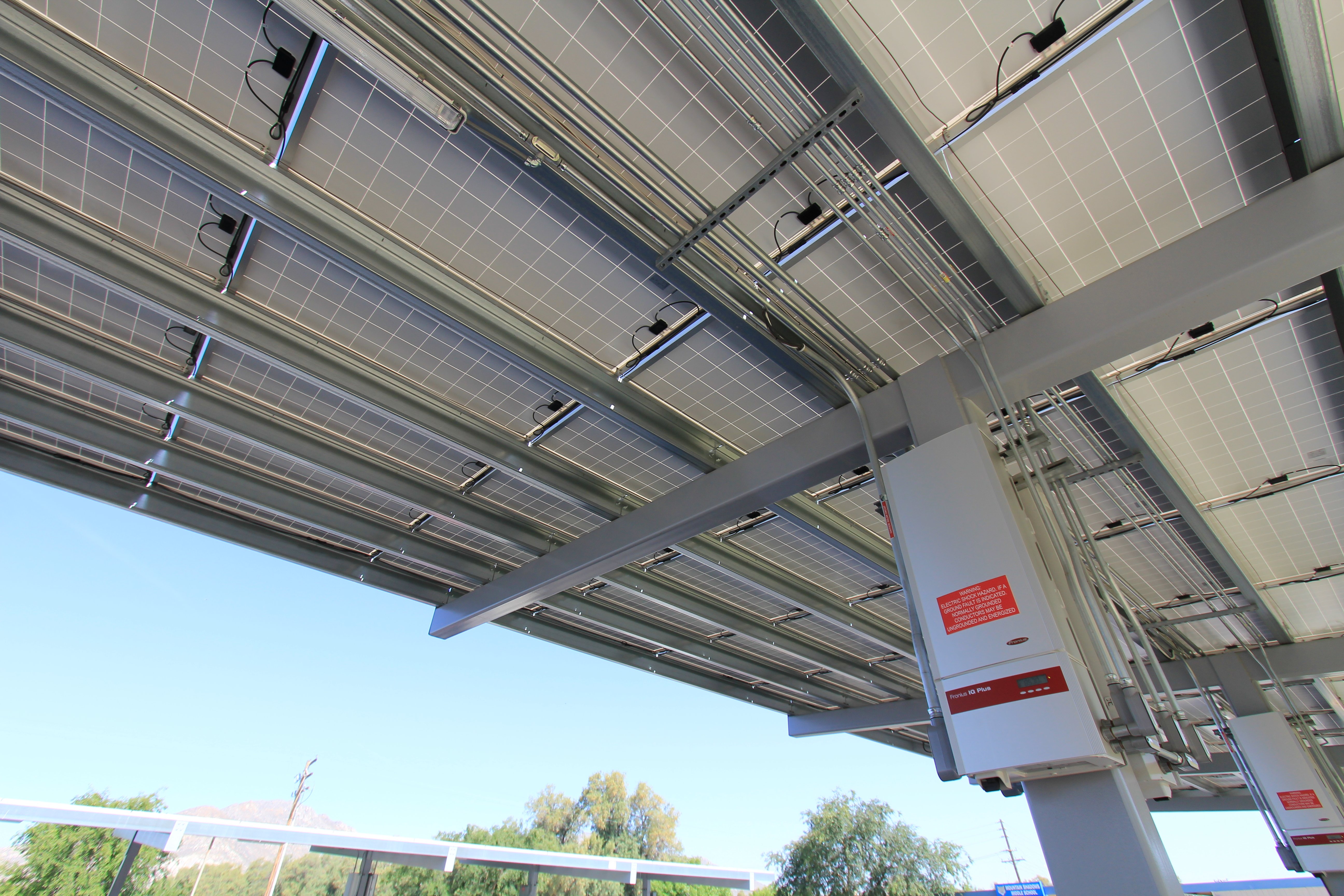 Solar canopy infrastructure supporting EV charging and fleet electrification projects.