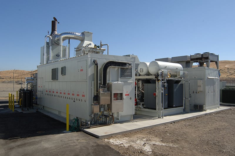 Fuel cell power generation units installed outdoors against a blue sky at the Alameda County Santa Rita Jail.