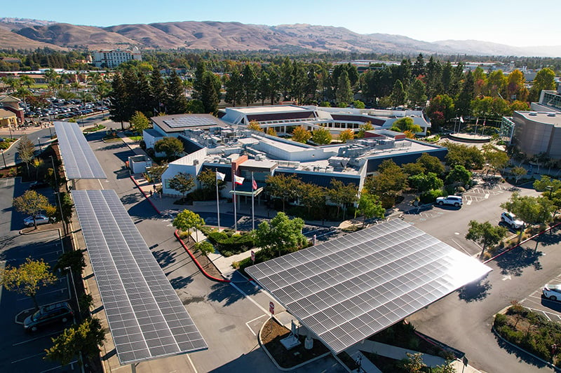 Aerial view of solar carport canopies and a microgrid installation at a City of Milpitas facility.